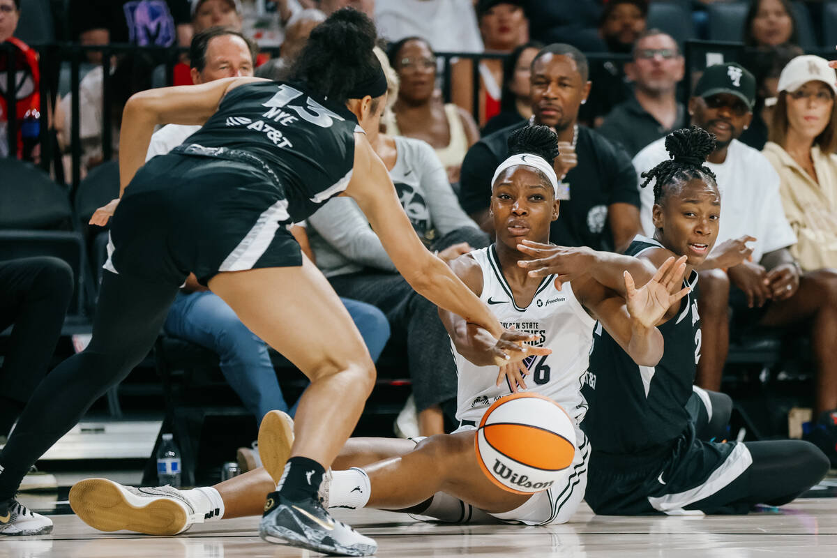 Golden State Valkyries guard Kaila Charles (6) battles Aces guard Aaliyah Nye (13) and Aces gua ...