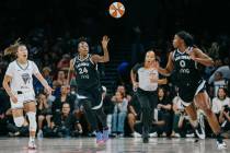 Aces guard Jewell Loyd (24) passes the ball to Aces guard Jackie Young (0) during a WNBA game b ...