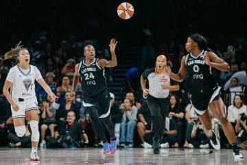 Aces guard Jewell Loyd (24) passes the ball to Aces guard Jackie Young (0) during a WNBA game b ...
