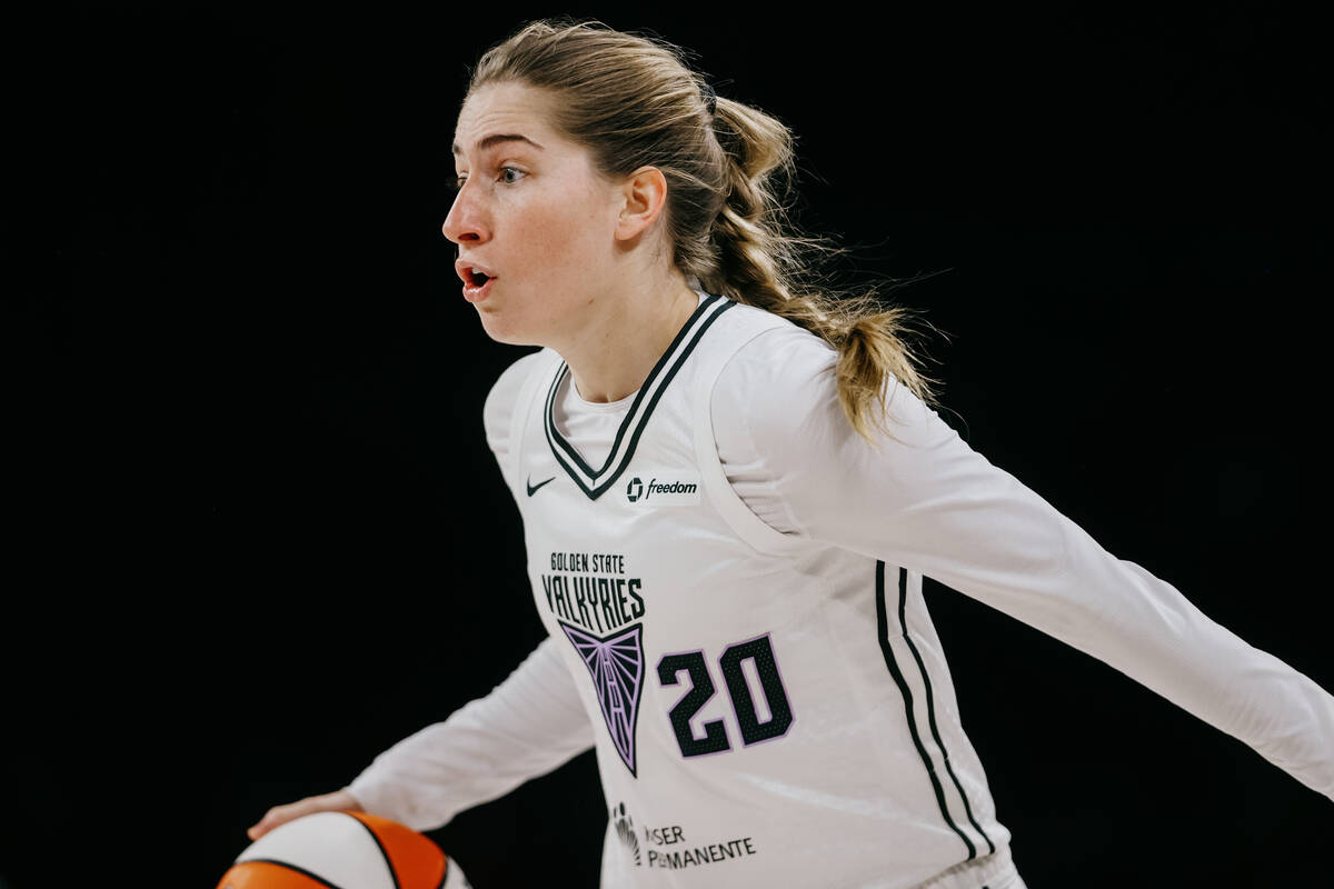 Golden State Valkyries guard Kate Martin (20) dribbles the ball during a WNBA game between the ...