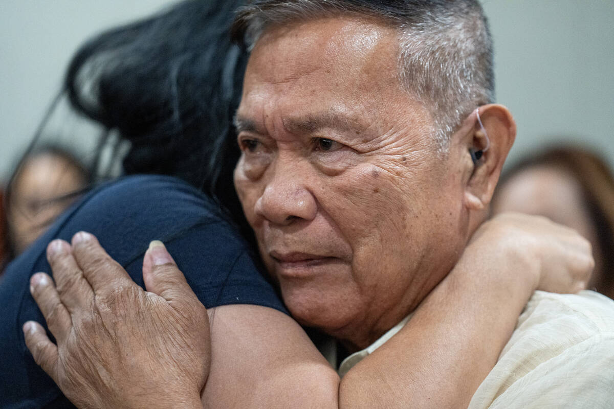 Amadeo Quindara is embraced by family friend Minddie Lloyd as Christian Lentz is sentenced in L ...