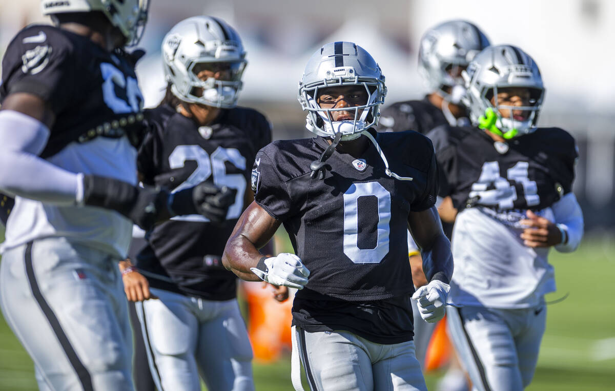 Raiders cornerback Jakorian Bennett (0) runs on warm ups during training camp on Thursday, July ...