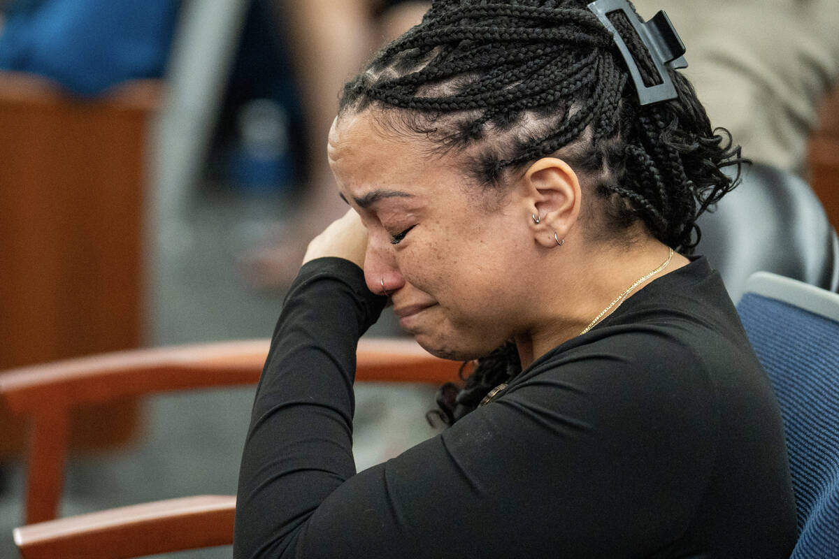 Natasha Menon cries as her husband, Kevin Menon, a former Metropolitan Police Department sergea ...