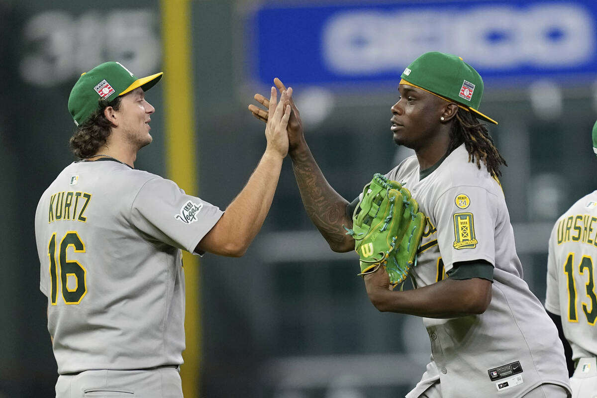 Athletics' Nick Kurtz (16) and Lawrence Butler celebrate after a baseball game against the Hous ...