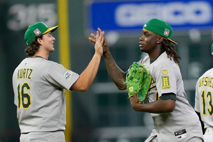 Athletics' Nick Kurtz (16) and Lawrence Butler celebrate after a baseball game against the Hous ...