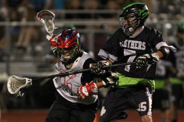 Coronado's Blake Day, left, drives towards the goal as Palo Verde's Cory Christensen body check ...