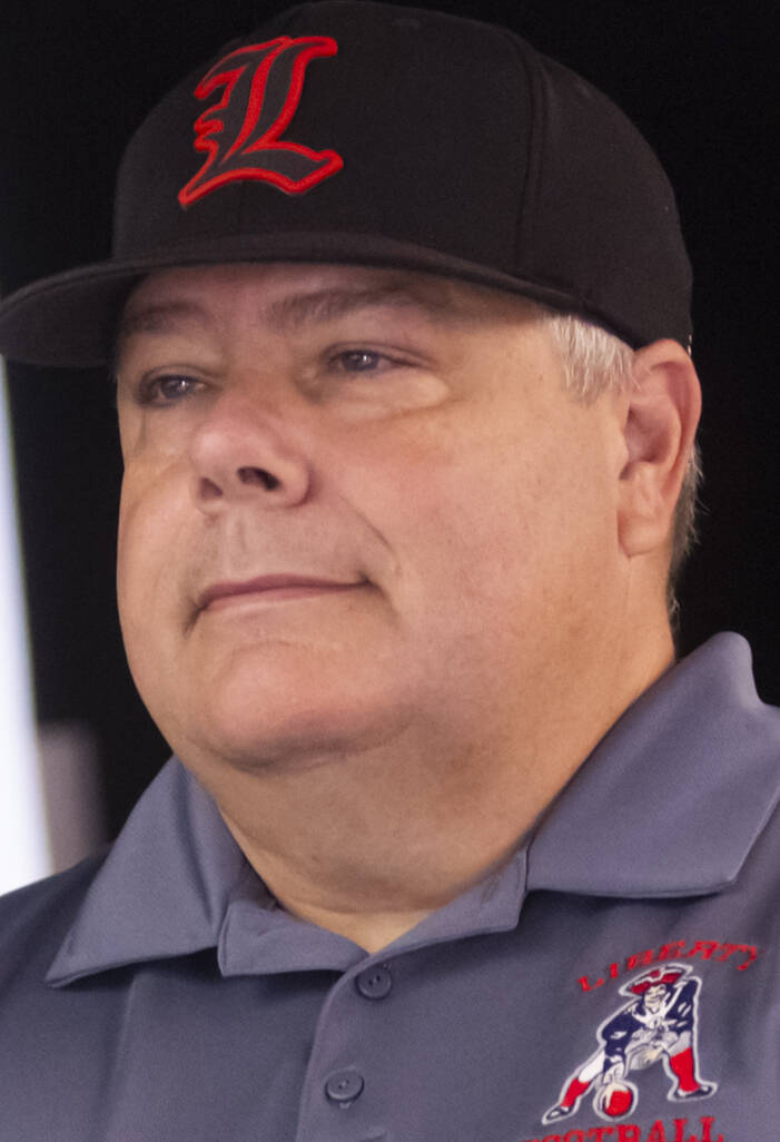 Liberty football head coach Rich Muraco poses for a photo during a preseason meeting and media ...