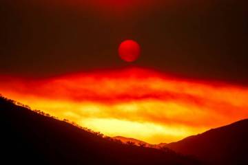 Smoke from the Gifford Fire fills the sky as the sun sets over Los Padres National Forest, Cali ...