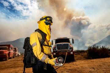 Firefighter Matthew Lake battles the Gifford Fire on Monday, Aug. 4, 2025, in Los Padres Nation ...