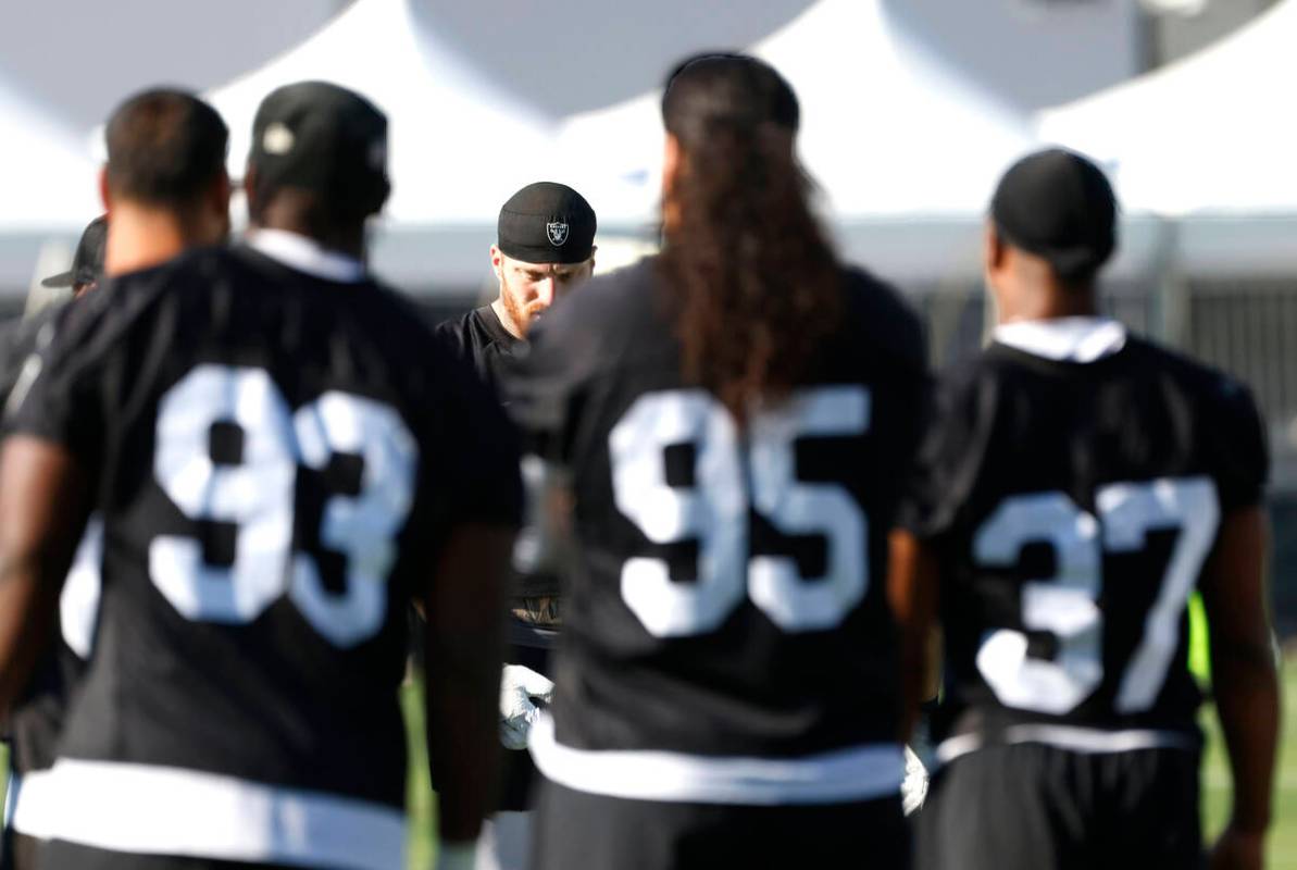 Raiders defensive tackles Zach Carter (93) Leki Fotu (95) safety Trey Taylor (37) and defensive ...