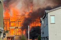Smoke and flames erupt from a construction site fire in North Las Vegas Tuesday, August 5, 2025 ...