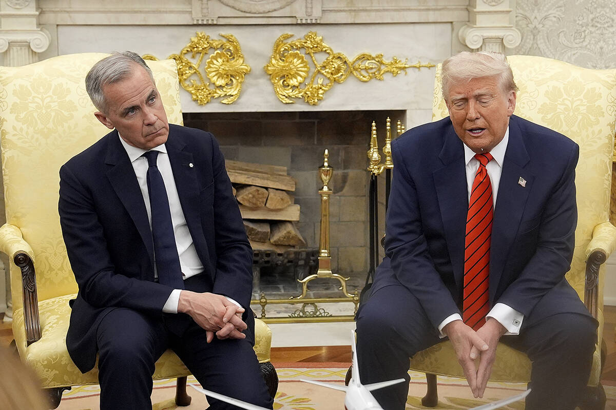 Prime Minister Mark Carney and U.S. President Donald Trump engage in a meeting at the White Hou ...