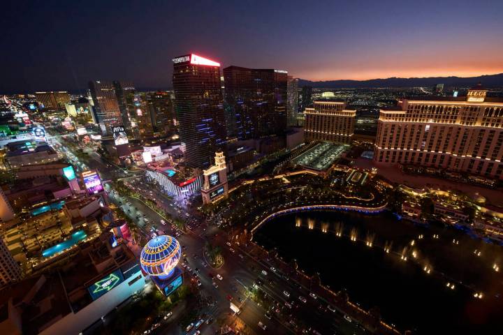 Cars drive along the Las Vegas Strip, Saturday, Aug. 2, 2025, in Las Vegas. (AP Photo/John Locher)