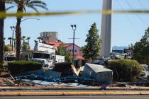 Debris scatters over the side of the road after a crash on Buffalo and Vegas Drive on Thursday, ...