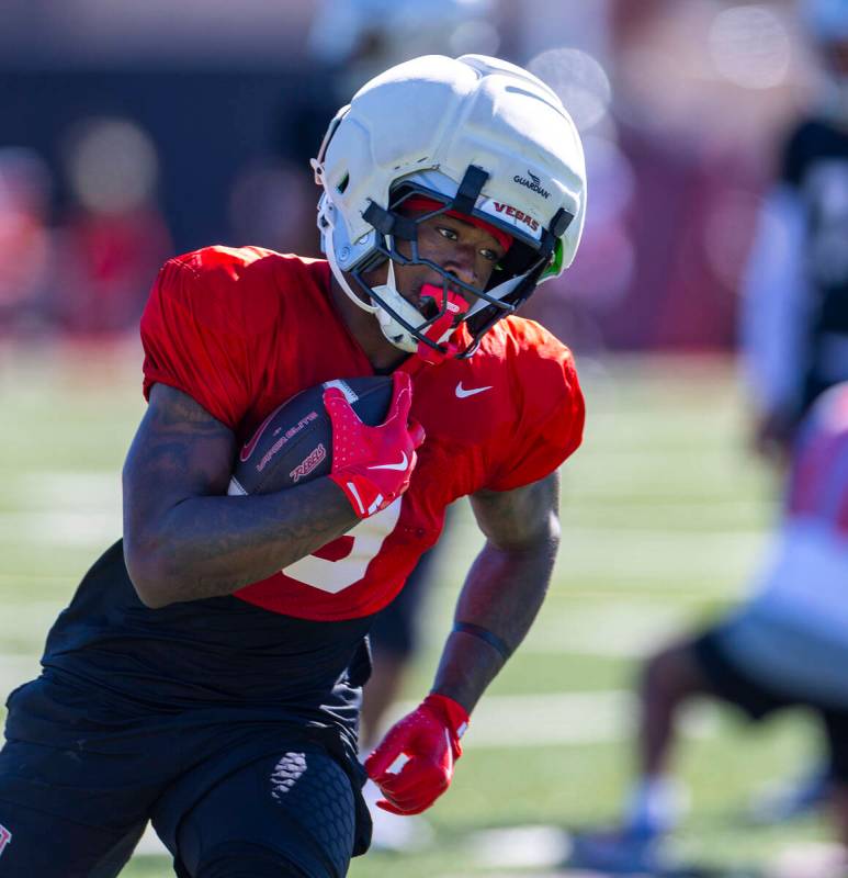 UNLV running back Jai'Den Thomas (9) runs up the field after breaking free of the line during f ...