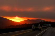 Smoke from the Gifford Fire fills the sky as the sun sets over Los Padres National Forest, Cali ...