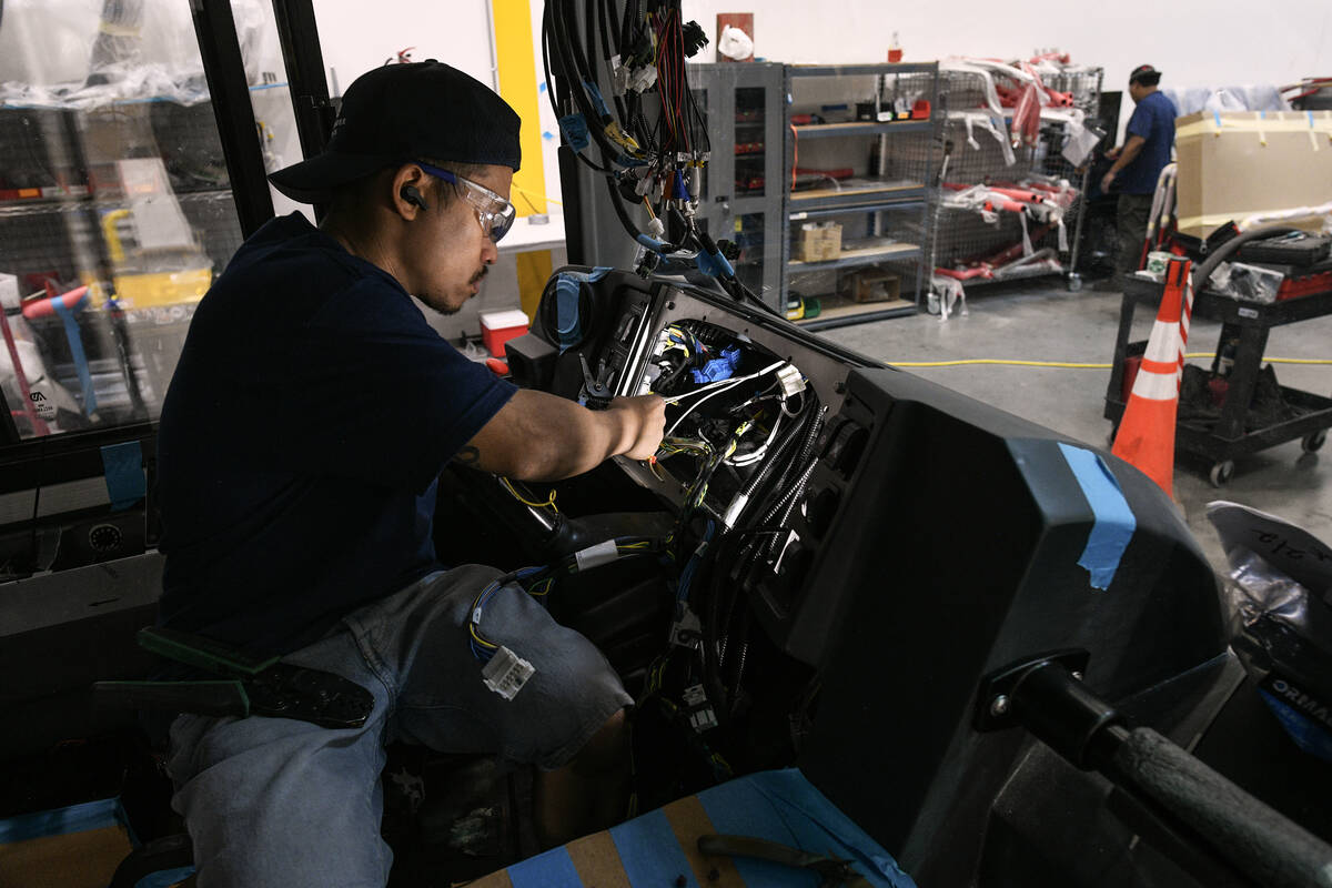 Edgev Barbaso wires up the dashboard on a bus at Alexander Dennis, the nation’s only manufact ...