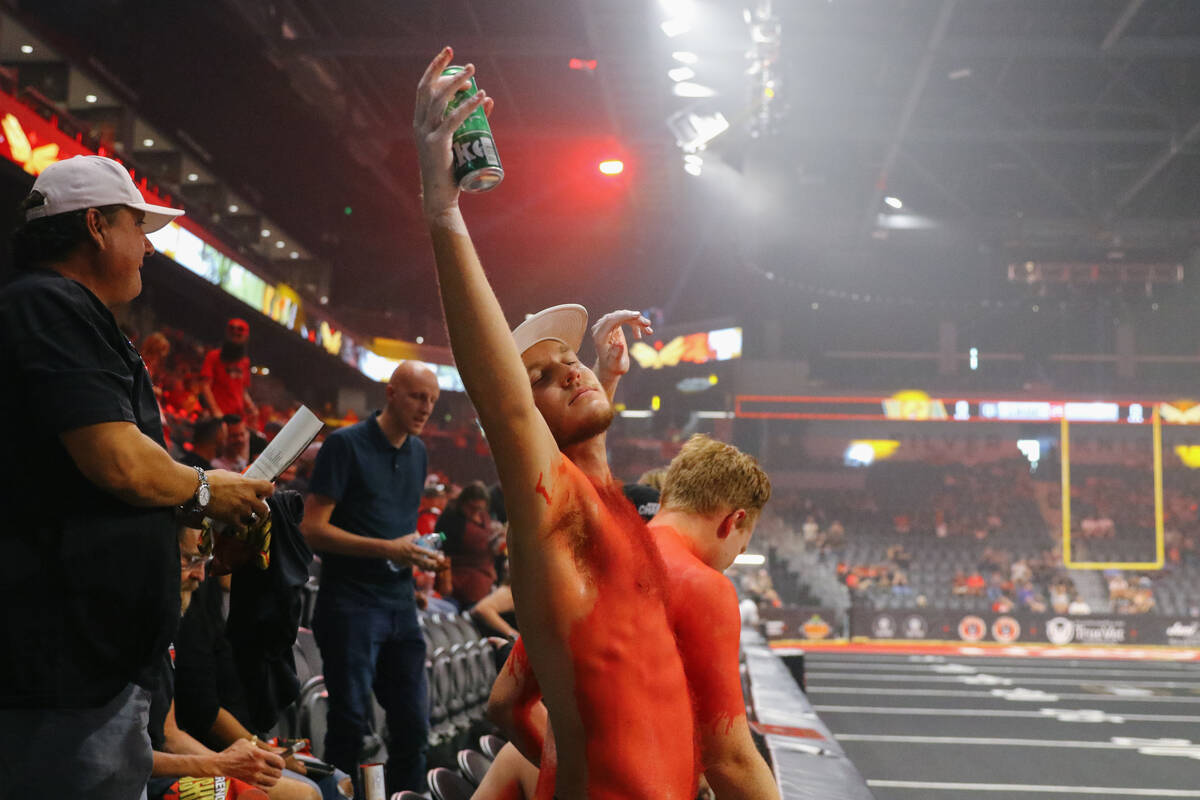 A Knight Hawks fan holds up his beer before the start of the Indoor Football League’s We ...