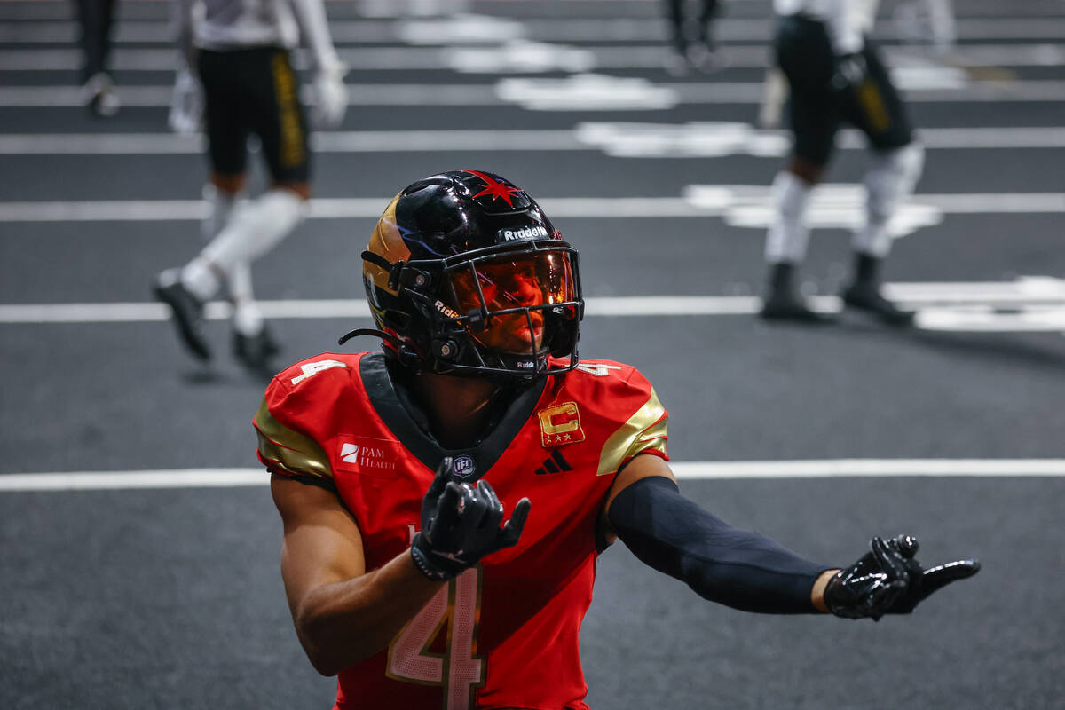 Knight Hawks wide receiver Quentin Randolph (4) makes a Spiderman pose after running the ball u ...