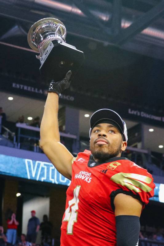 Knight Hawks wide receiver Quentin Randolph (4) holds up the Indoor Football League’s We ...