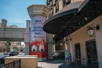 Pedestrians pass by the elevator towers along The Strip on Aug. 5, 2025 in Las Vegas. The Clark ...