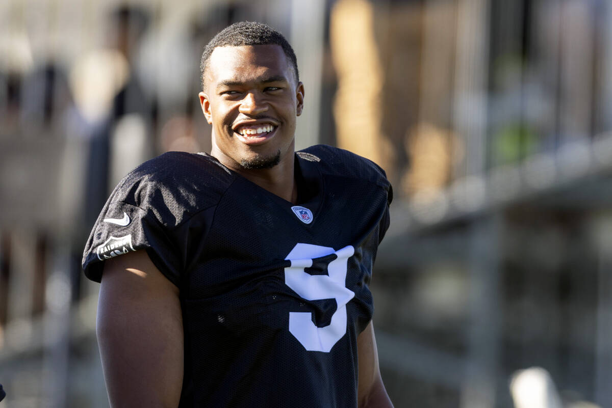 Raiders defensive end Tyree Wilson (9) laughs with teammates during the team’s training ...