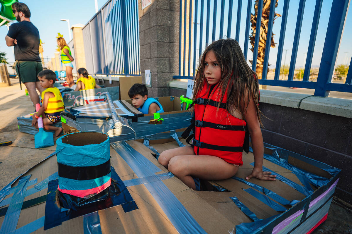 Boaters wait for their turn to compete during a boat regatta competition at Desert Breeze Swimm ...