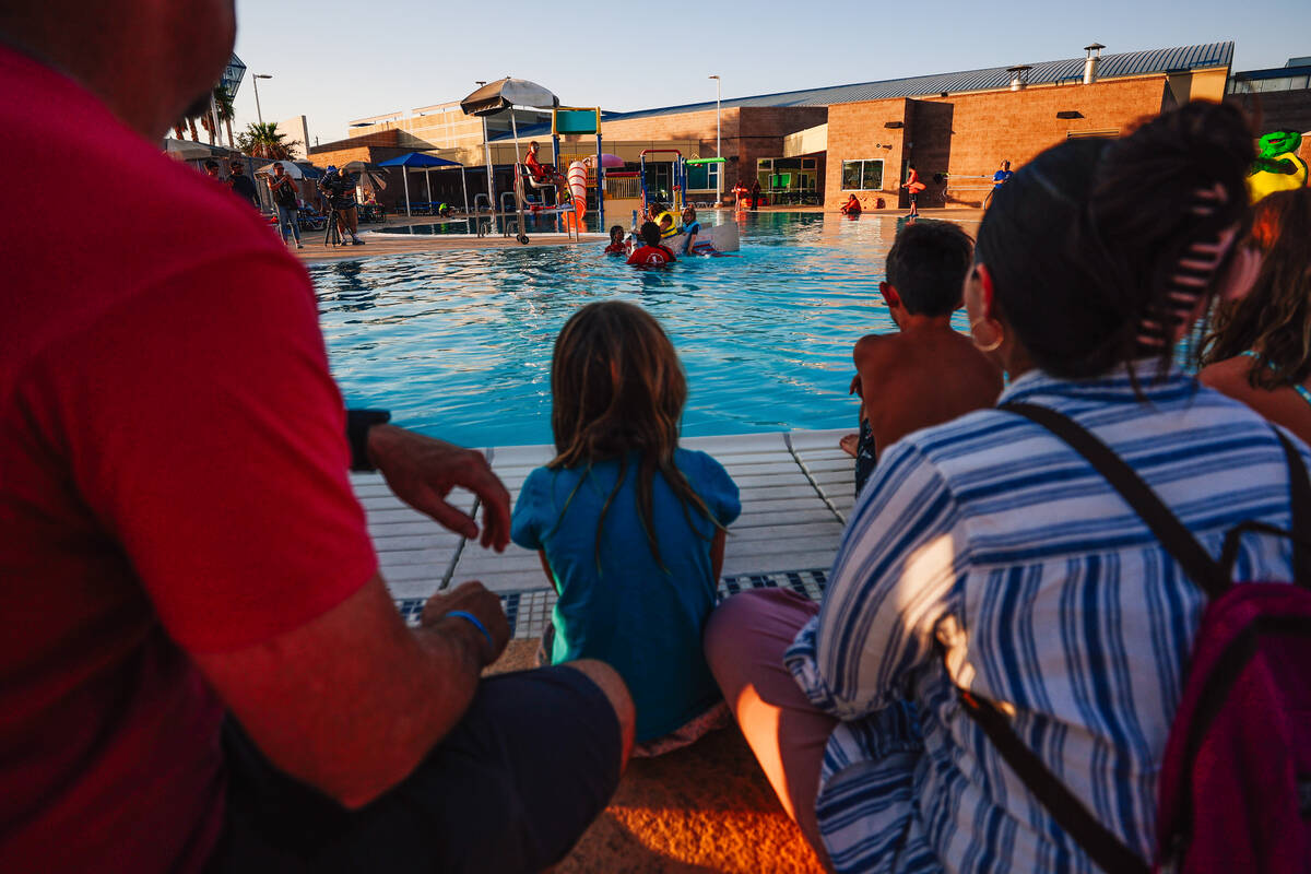Spectators watch during a boat regatta competition at Desert Breeze Swimming Pool Friday, Aug. ...