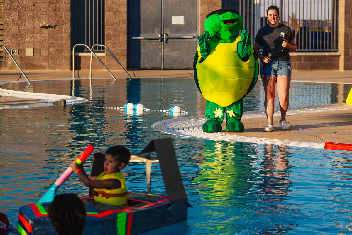 Tommy the Turtle cheers during a boat regatta competition at Desert Breeze Swimming Pool Friday ...