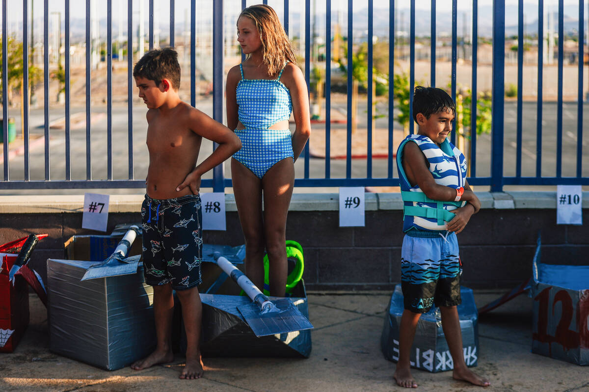 Boaters wait their turns during a boat regatta competition at Desert Breeze Swimming Pool Frida ...