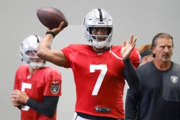 Raiders quarterback Cam Miller (5) and quarterbacks coach Greg Olson, right, watche as Geno Smi ...