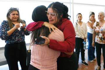 Anabel Sarabia, center right, the mother of a shooting victim Angelina Erives, 11, and Janicee ...