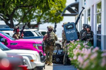 SWAT officers enter Glass Vegas as they join North Las Vegas Police with their Public Safety Un ...