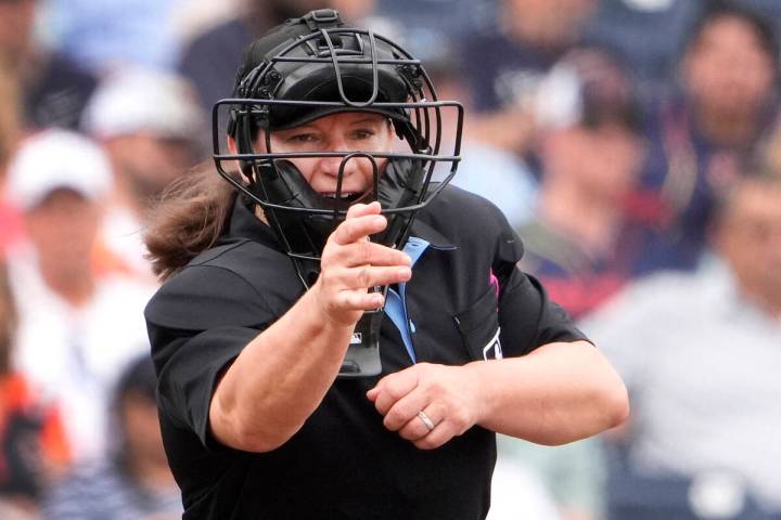 Home plate umpire Jen Pawol calls a strike during the third inning of a spring training basebal ...