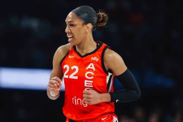 Aces center A'ja Wilson runs down the court with an eye injury during a WNBA basketball game be ...