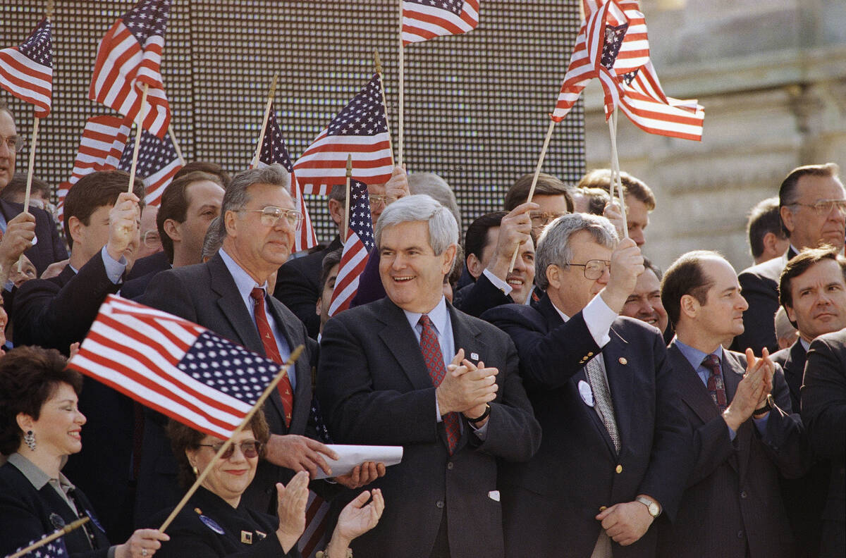 House Speaker Newt Gingrich of Ga., flanked by House Majority Leader Dick Armey of Texas, and R ...