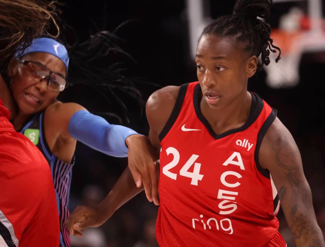 Aces guard Jewell Loyd (24) drives past Atlanta Dream guard Allisha Gray (15) during the first ...
