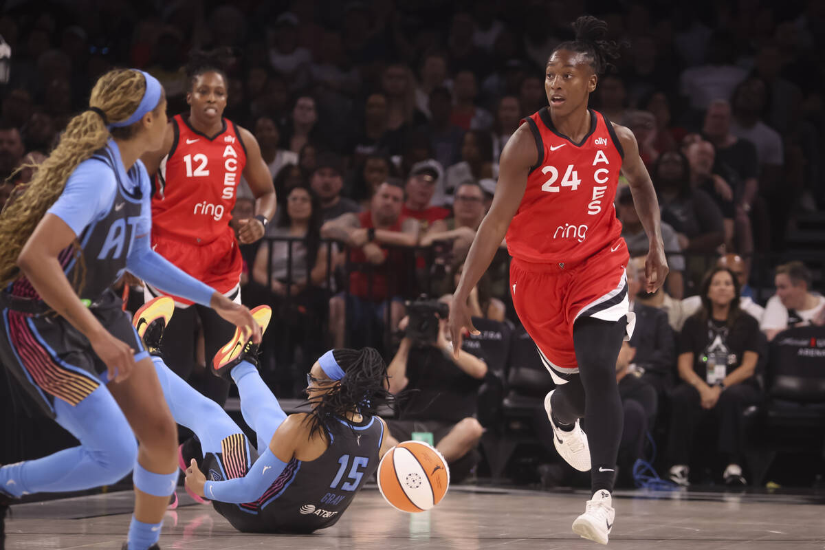 Aces guard Jewell Loyd (24) brings the ball up court past Atlanta Dream guard Allisha Gray (15) ...