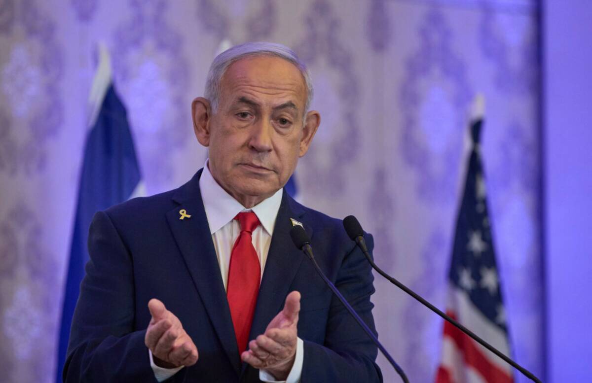 Israeli Prime Minister Benjamin Netanyahu speaks to the audience at a conference in Jerusalem, ...