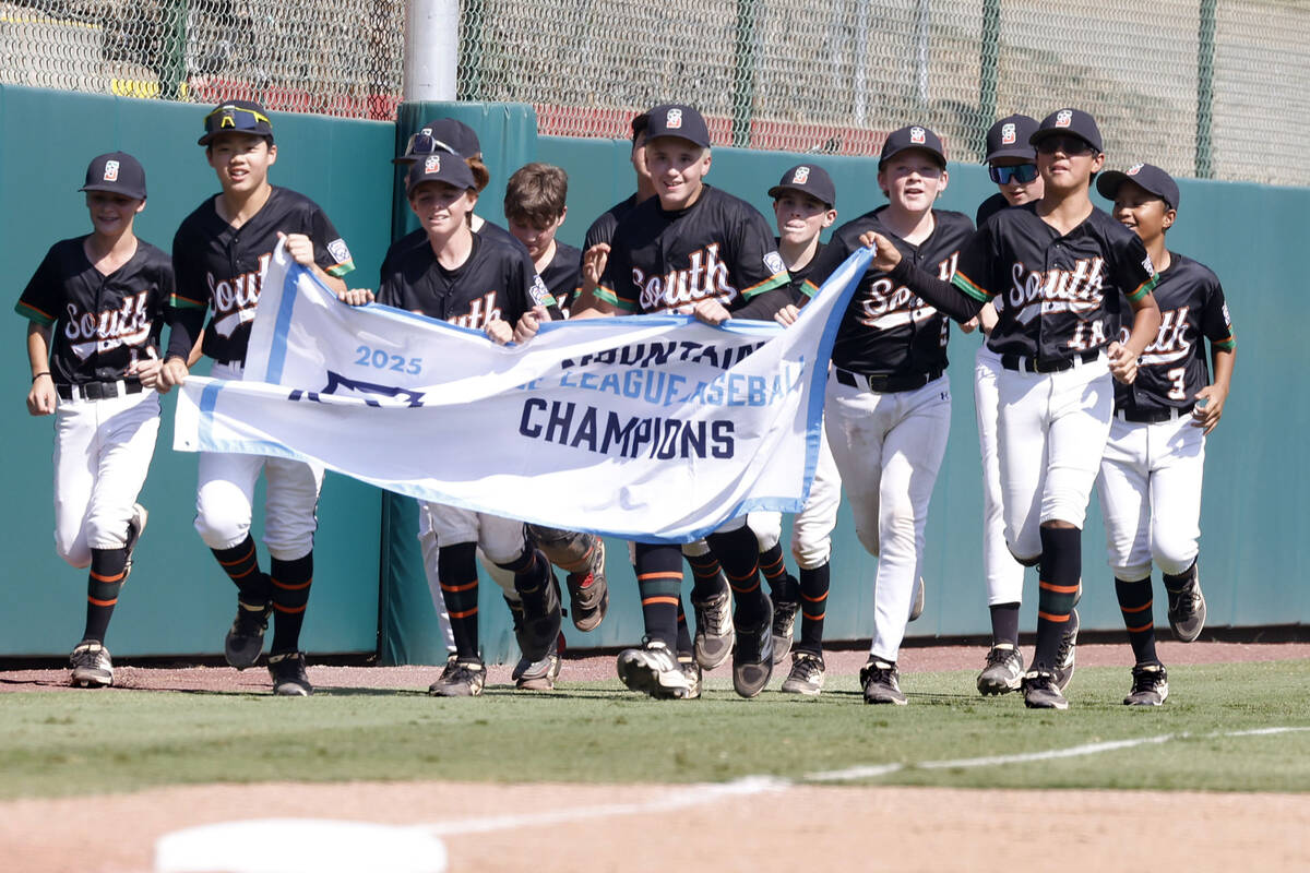 Nevada players celebrate their 6-3 win against Utah during the Mountain Regional final baseball ...