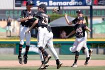 Nevada players celebrate their 6-3 win against Utah during the Mountain Regional final baseball ...