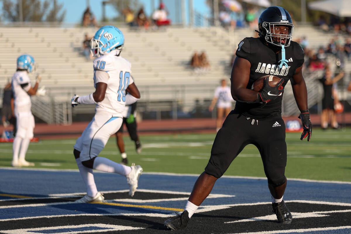 Desert Pines tight end Michael Taylor (9) scores a touchdown during the first half of a high sc ...