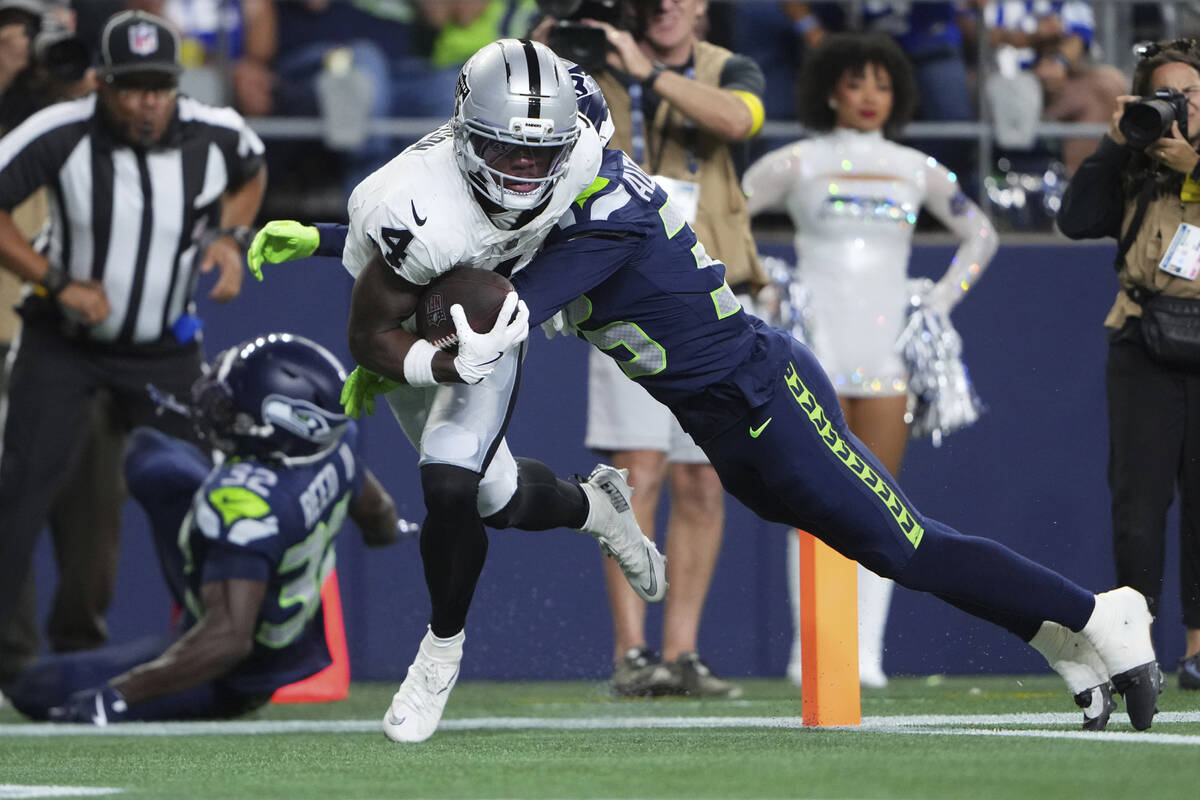 Las Vegas Raiders wide receiver Shedrick Jackson (4) scores a touchdown during the second half ...