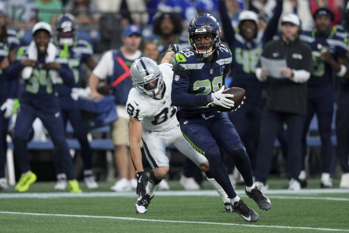 Seattle Seahawks cornerback Nehemiah Pritchett (28) intercepts the ball intended for Las Vegas ...