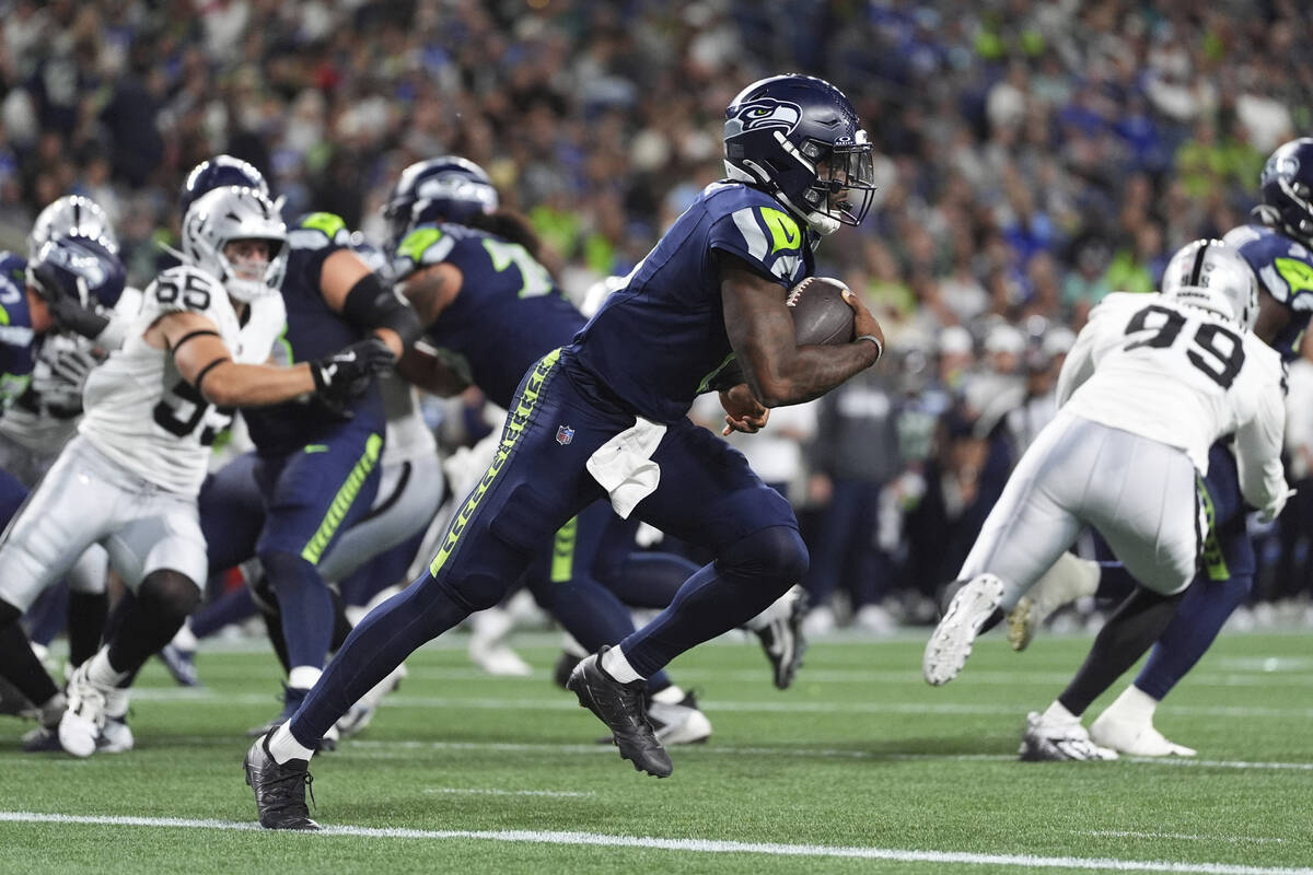 Seattle Seahawks quarterback Jalen Milroe (6) runs with the ball during the second half of an N ...