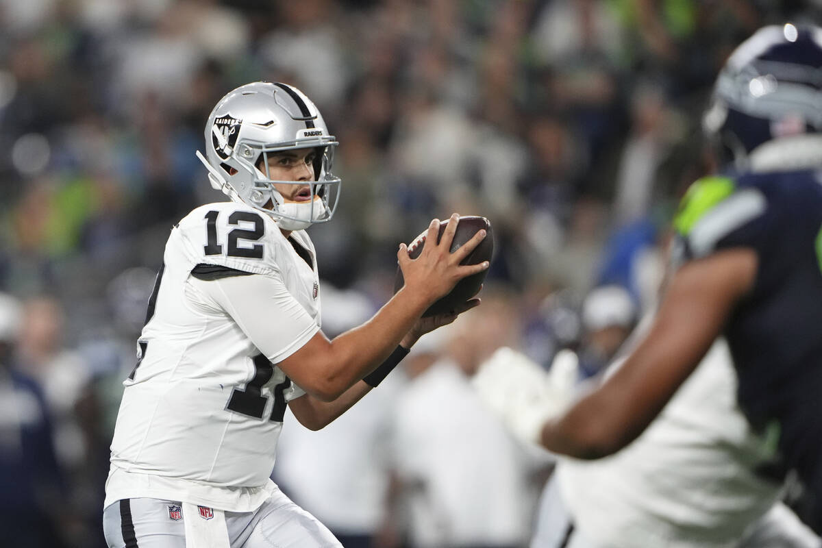 Las Vegas Raiders quarterback Aidan O'Connell (12) looks to throw pass during the second half o ...