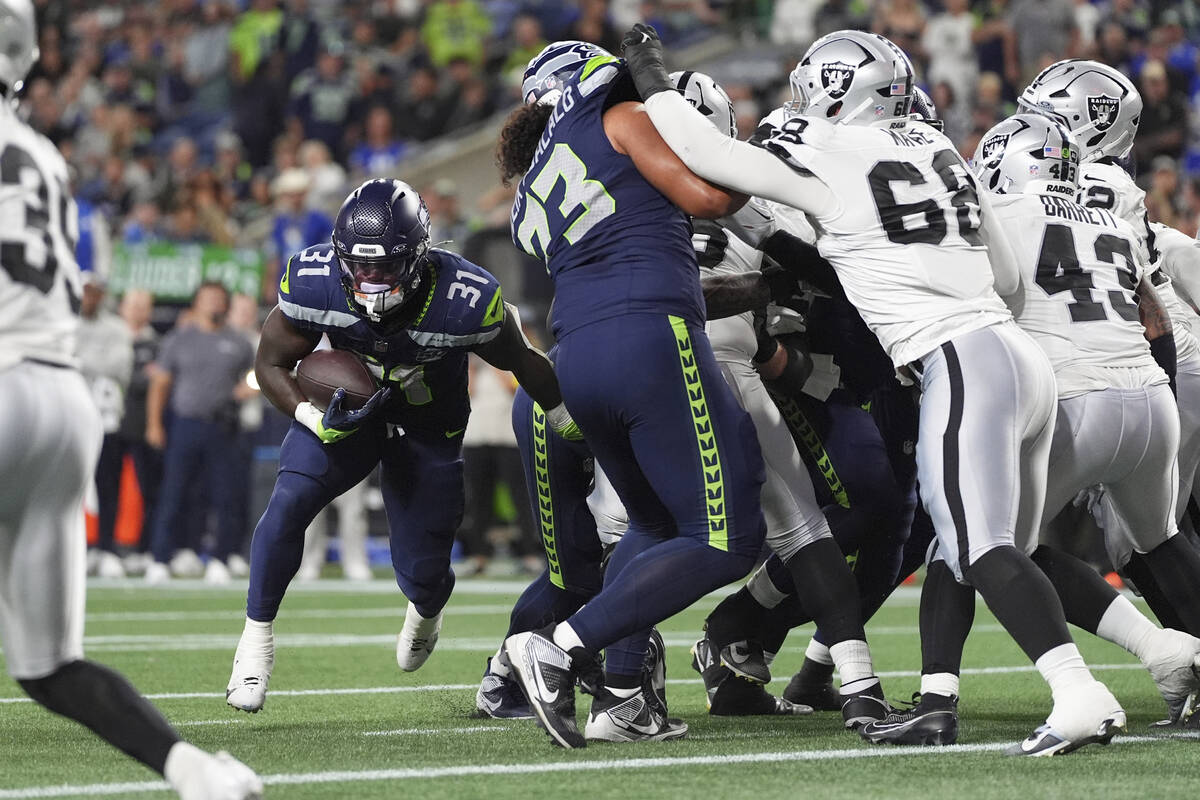 Seattle Seahawks running back Jacardia Wright (31) runs for a touchdown during the second half ...