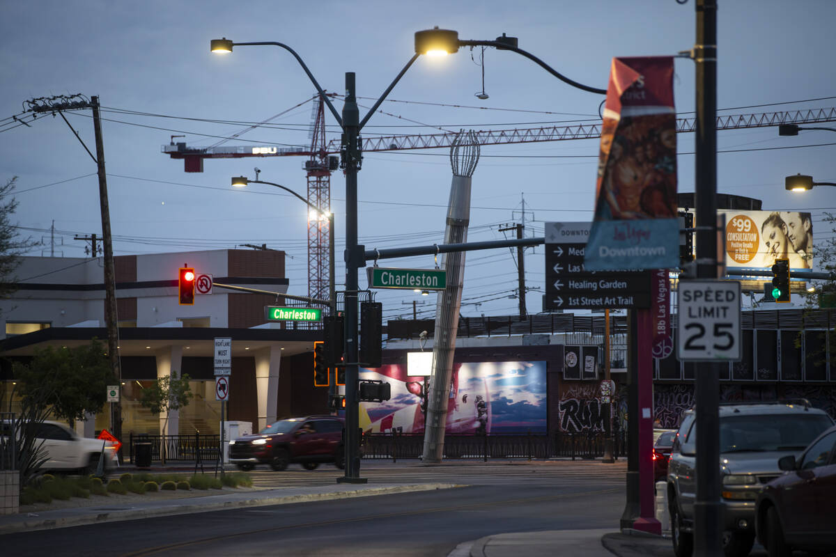 A crane is seen in the distance as traffic travels along Charleston Boulevard in the Arts Distr ...