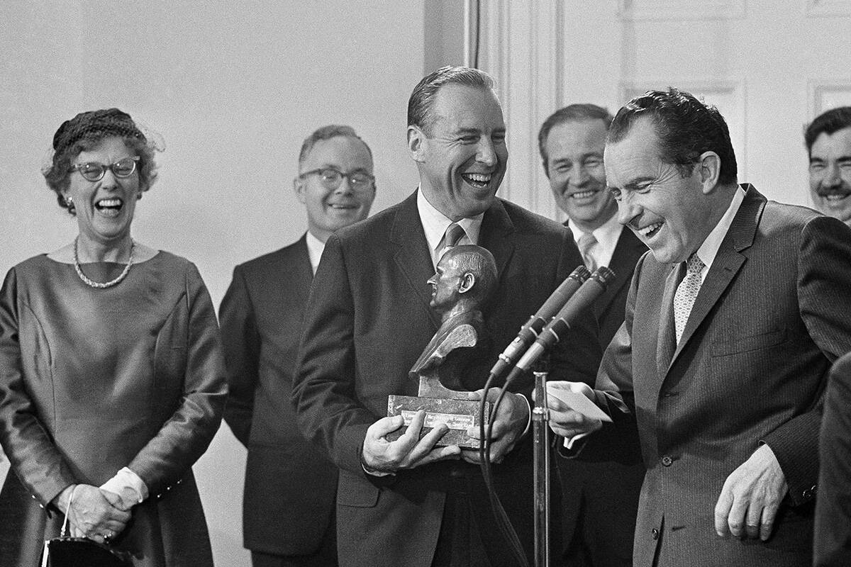 President Richard Nixon and Navy Capt. James A. Lovell, Jr., join in laughs, March 5, 1969 duri ...