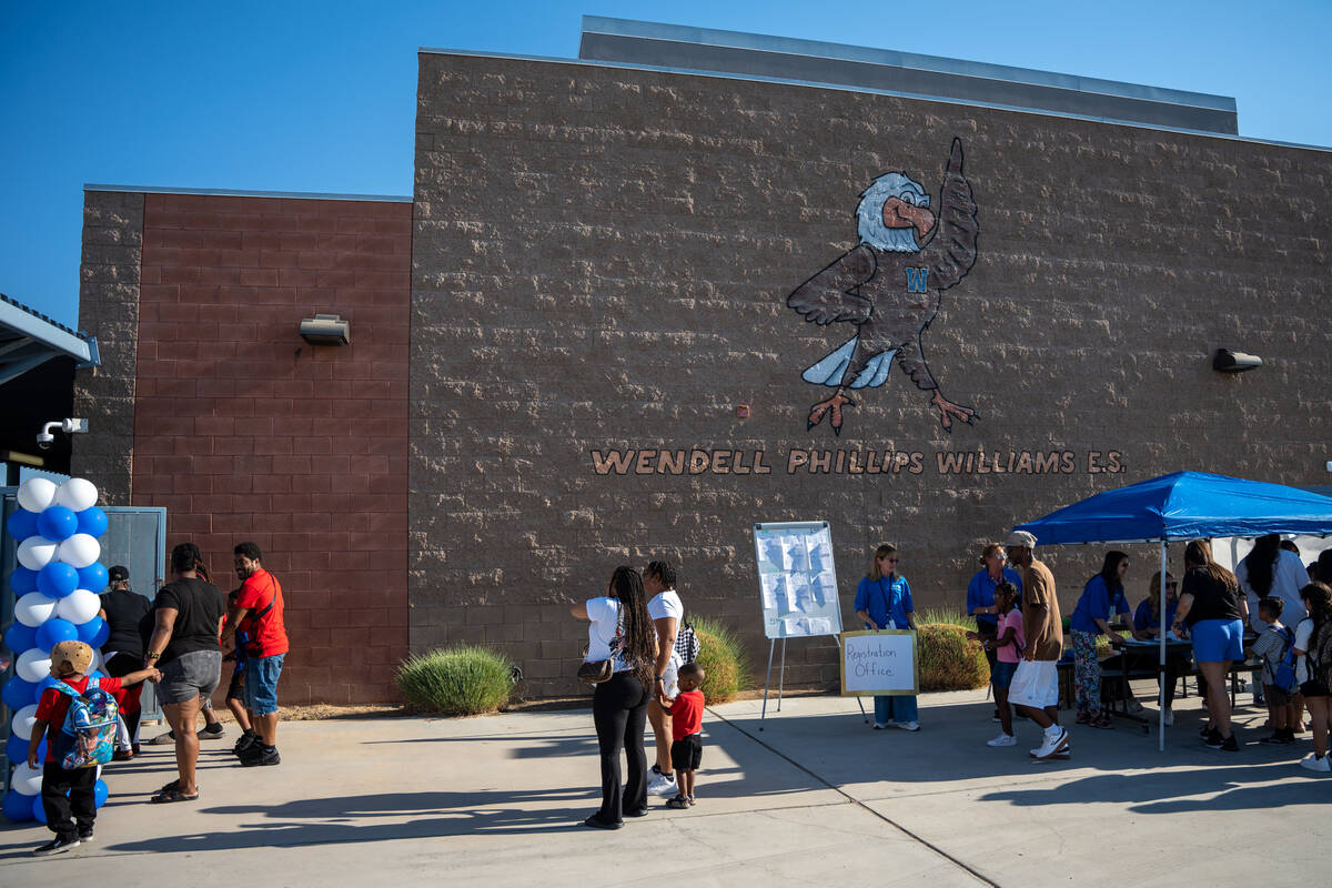Children attending Wendell P. Williams Elementary School are checked in for the first day of th ...